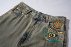 Wide-Leg Washed Denim Jeans with Hand-Embroidered Pocket