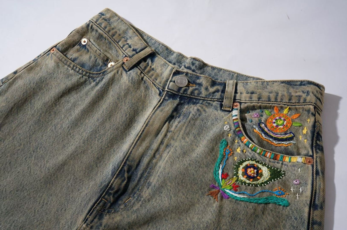 Wide-Leg Washed Denim Jeans with Hand-Embroidered Pocket